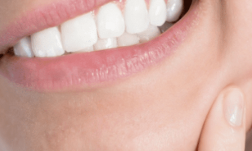 Photo of a woman's gritted teeth