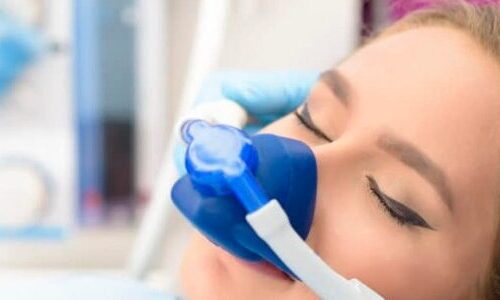 Photo of a woman receiving nitrous oxide during treamtents