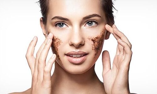 Photo of a woman using product to exfoliate her skin