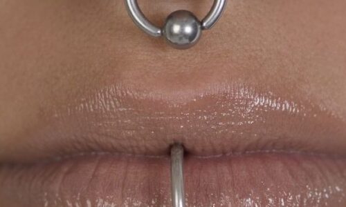 Photo of a nose and lip ring