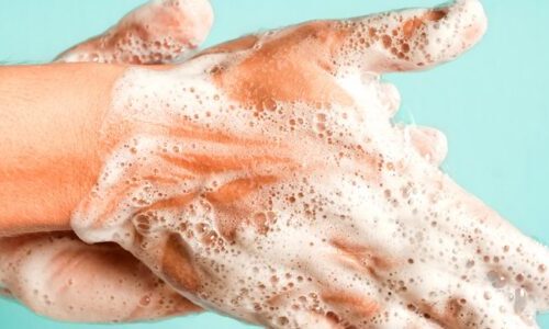 Photo of a person washing their hands