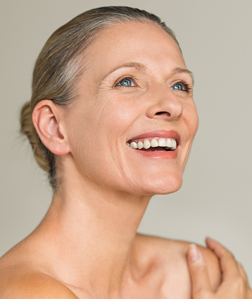 Photo of a smiling older woman with great skin
