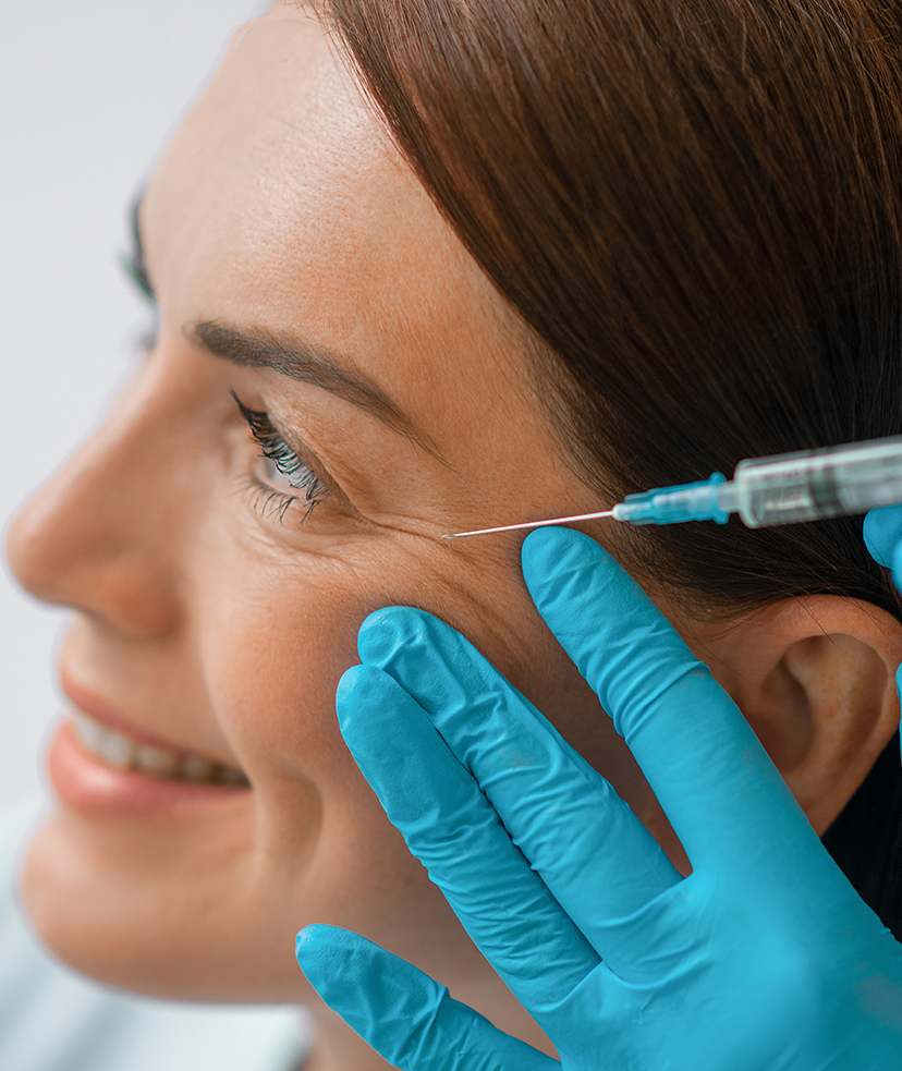 Photo of a woman receiving a cosmetic treatment with a syringe