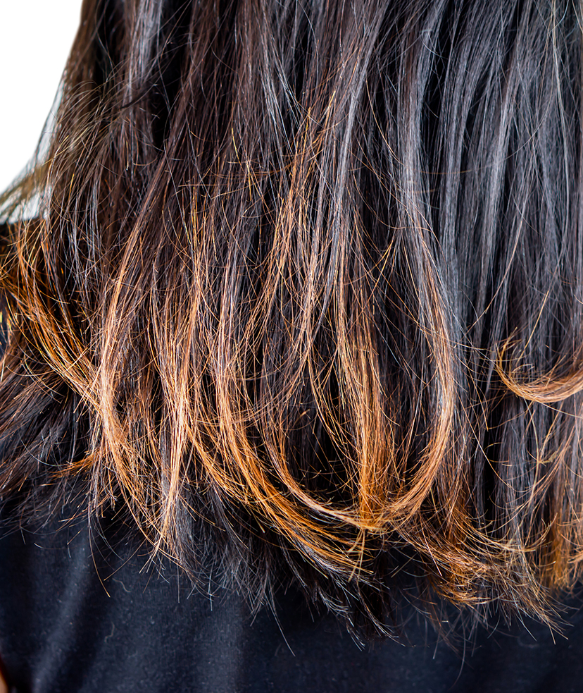 Photo of a woman's hair with highlighted tips