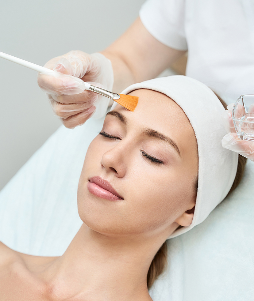 Photo of a woman receiving a chemical peel treatment