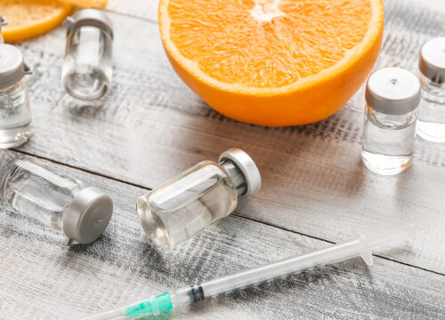 Photo of vitamin injections and oranges